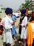 Men wearing modern chola