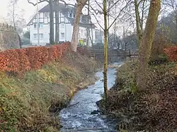 The Repe River flowing near a house