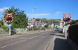 An open level crossing with warning lights and signs known as an AOCL in Dingwall, Highland. Now an AFBCL.