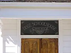 Dixie Schoolhouse sign over door