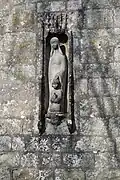 Carving on the south face of the tower of St Nicholas church in Durweston, Dorset, by Don&nbsp;Potter (1991)