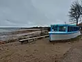 A boat turned into a dining area on the beach