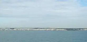 Panoramic photo: cliffs barring the distant horizon
