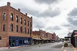 A group of buildings line a downtown street