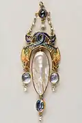 pendant with intertwined dragons, and sapphires