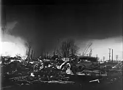 The violent tornado at peak intensity as seen from Midway. The damage in the foreground is from the first tornado