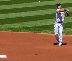 Dylan Moore throwing a baseball from the infield in a Seattle Mariners uniform