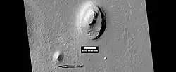 Buttes, as seen by HiRISE under HiWish program. Buttes have layered rocks with a hard resistant cap rock on the top which protects the underlying rocks from erosion.