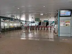 A series of faregates dividing the paid and unpaid areas of the station