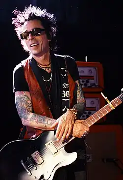 Slick performing with New York Dolls in 2011