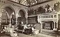 The Saloon, Eaton hall (c.1883 destroyed c.1962), note the Henry Stacy Marks murals of the Pilgrims from The Canterbury Tales, the elaborately carved marble fireplace, columns and arches, the rows of columns and arches delineate the corridor passing through the building, beyond which is the Entrance Hall with its elaborate mosaic floor.
