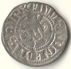 A faded silver coin with an indistinct king's head in the centre with long hair, surrounded by faded writing.