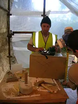 At work on the stone for the central pier. Note the craft tools