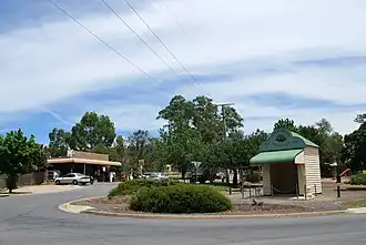 The main street of Eldorado. A Soldiers Memorial bus shelter is in the foreground while the General store and McEvoy Tavern ("The smallest pub in Victoria") can be seen to the left.