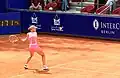 Dementieva hitting a backhand.