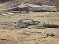 A farmstead standing between the river and a stream