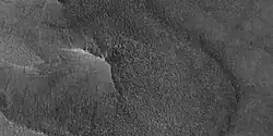 Close-up of East side (right side) of previous image of pedestal crater showing polygons on lobe. Since the margin of the crater has lobes and polygons, it is believed there is ice under the protective top. Picture taken with HiRISE under HiWish program. Note: this is an enlargement of the previous image.