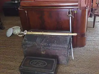 A sword on a chest on the ground
