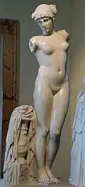 The Esquiline Venus, 1st century AD Roman copy of a late Hellenistic artwork from the 1st century BC, with a snake depicted on the vase at the base and a woman wearing a royal diadem.[88]