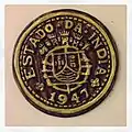 1947 escudo coin.