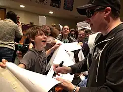 Étienne signing autographs for his fans in Ottawa, Ontario, Canada in 2018.