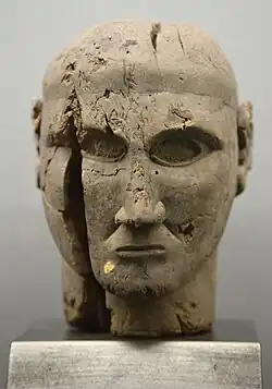 Etruscan pear wood head, 7th century BC