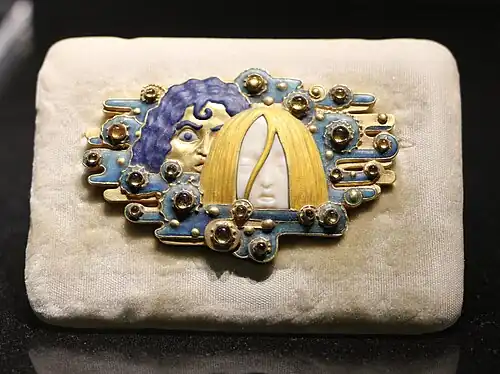 Appearances belt buckle, of gold, ivory, topaz, glazes, and cabachons, or rounded gemstones. designed by Eugène Grasset (c. 1900) (Musée d'Orsay)