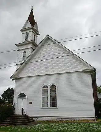 Exterior of the Evangelical Church of Lafayette. It's a white church building with a steeple.