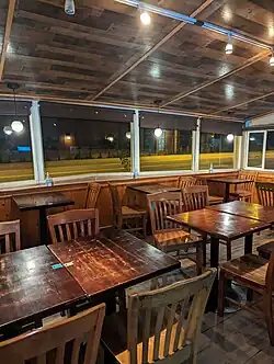 Interior evening photo of the dining room located inside Cholada Thai restaurant in Malibu, California.