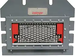 Extrusion die tool assembly showing detailed tooling structure.