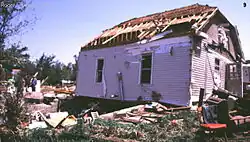 There is damage to mobile homes and other temporary structures becomes significant, and cars and other vehicles can be pushed off the road or flipped. Permanent structures can suffer major damage to their roofs.