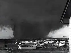 Photograph of the tornado's dark funnel cloud