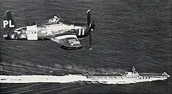 An F8F-2P over USS Midway 1949/50