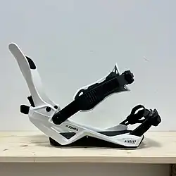 Snowboard binding using the FASE Fast Entry System shown in the open entry position without a boot.