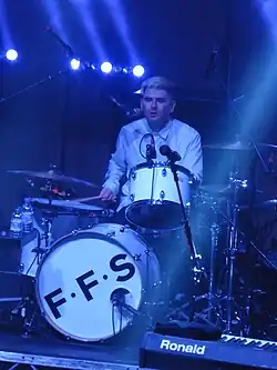 Thomson performing in 2015