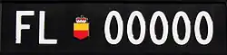 Genuine Liechtenstein vehicle registration plate with the invalid number 00000.