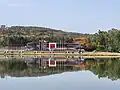 The arena viewed from the other side of the lake