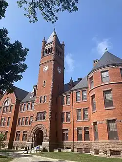 large red brick building with tall clock tower