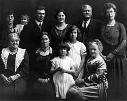Andrew's wife Lizzie (Bolden) Tozier is seated far left. Andrew Jr. ("AJ) is standing second from right.