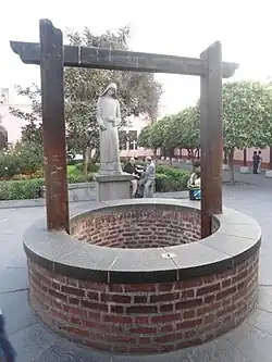 Water well into which devotees toss letters in memory of St. Rose