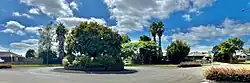 Farnborough Drive roundabout, Thornton - the suburb is flat, single storey, with wide, tree-lined roads