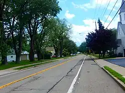 NY 249 east through the center of Farnham