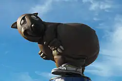 Side view of "Fatso the Fat-Arsed Wombat", an unofficial mascot for the 2000 Summer Olympics as he appeared on top of a pole outside Sydney's Stadium Australia