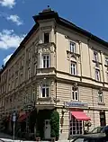 This neo-renaissance corner building, built in 1892, was originally the location of the sculpture of Heine, which was replaced by a year with and upside down "5".[13]