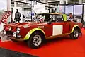 A Fiat 124 Abarth Rally (1972-75) in the yellow and red livery of the Abarth racing team.