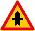 Junction with a minor road (formerly used )