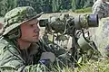Spotter from a sniper team observing targets