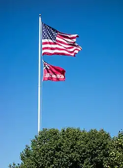 The flag of Taunton flies beneath the flag of the United States over Taunton Green