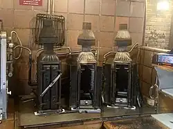 Three vertical flame broilers