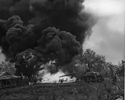 An M3A1 from the USMC 2nd Tank Battalion incinerates Japanese pillbox on Saipan.